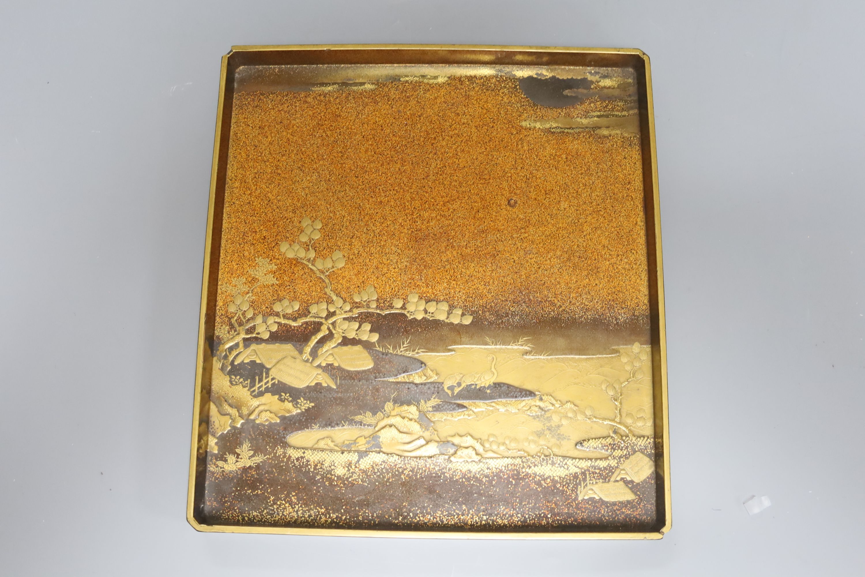 A good quality Japanese maki-e lacquer dish and a similar panel, Edo to Meiji period, largest 24.5cm